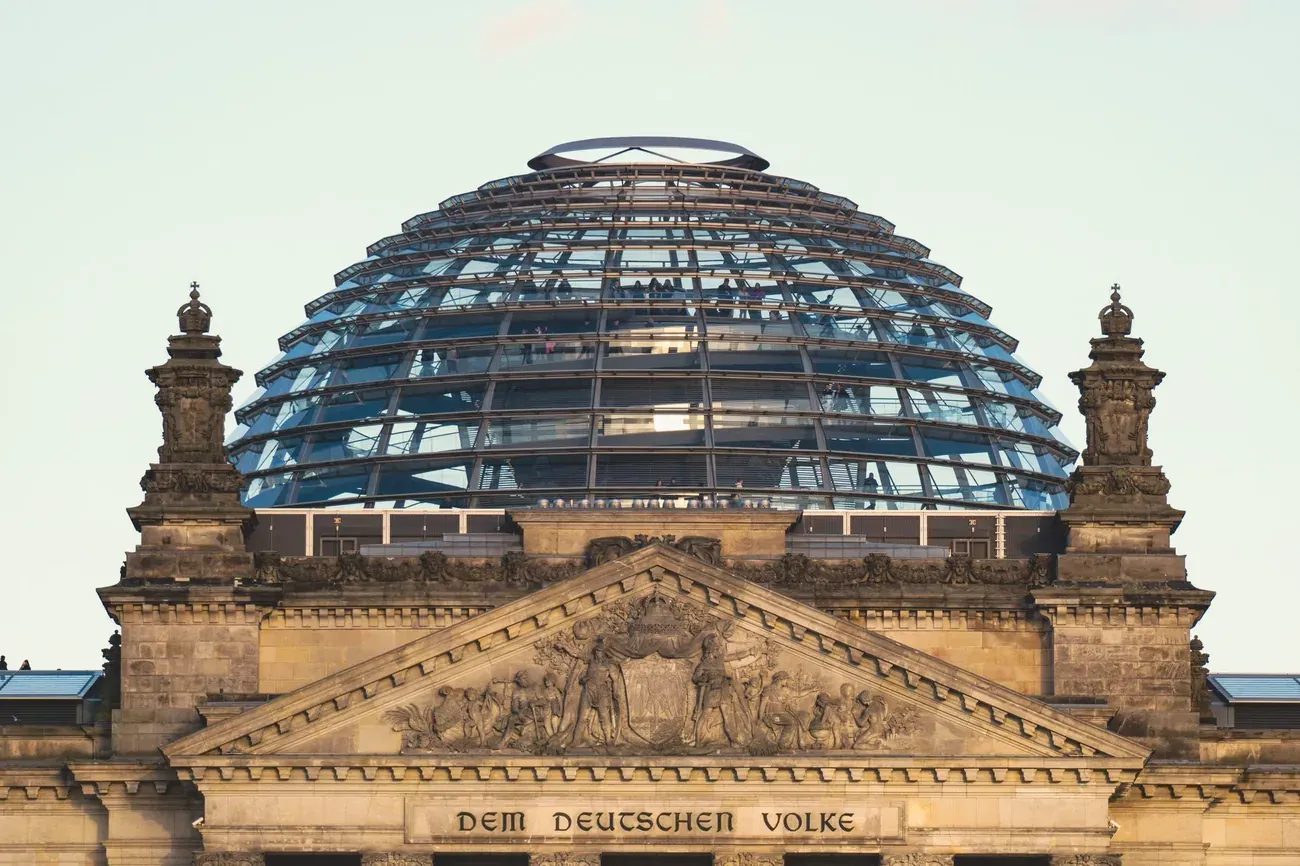 The glass dome of the Reichstag building in Berlin against a clear sky