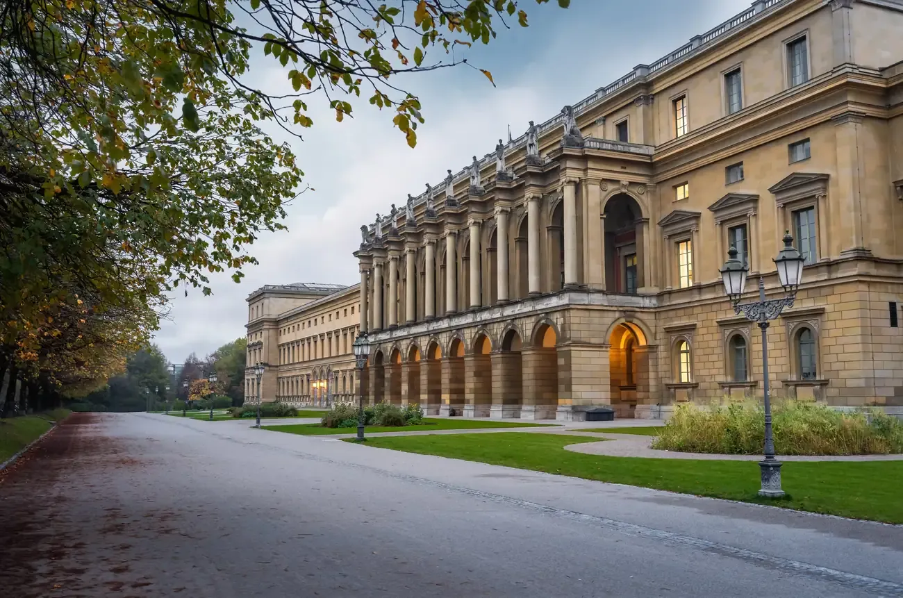 The long Festsaalbau facade of the Munich Residenz seen from the Hofgarten side in autumn