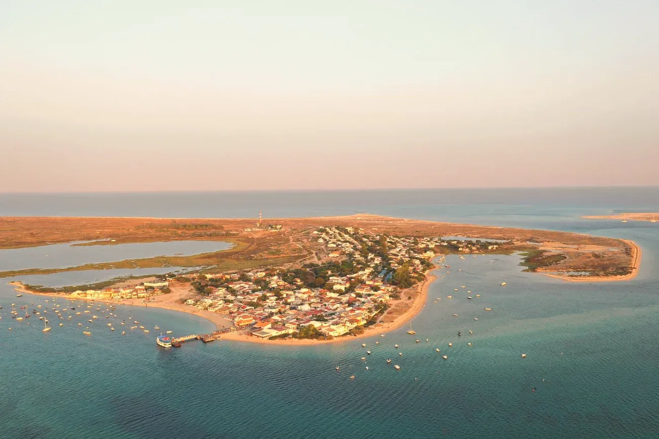 Aerial view of a barrier island village surrounded by the Ria Formosa lagoon near Faro, Portugal