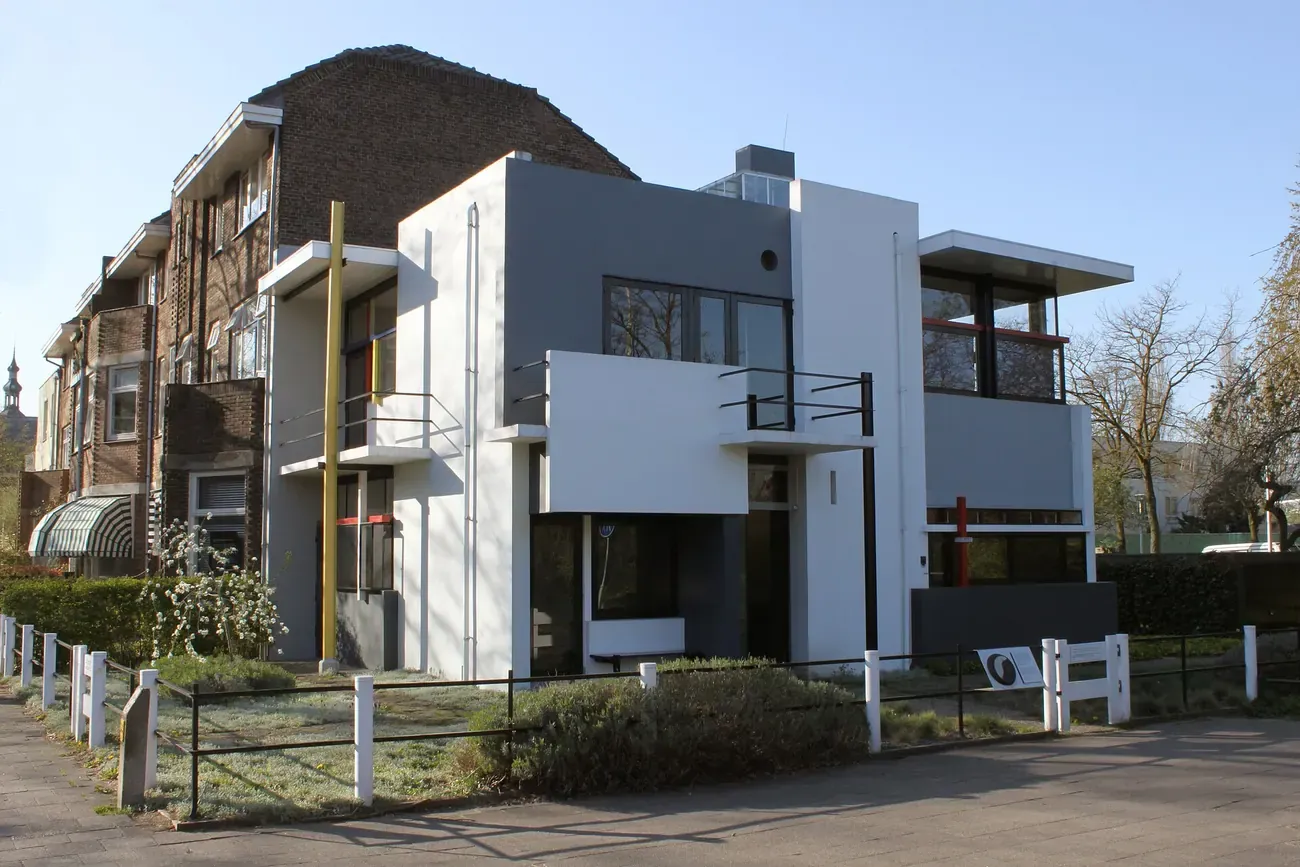 The white planes and coloured lines of the De Stijl exterior of the Rietveld Schroder House in Utrecht