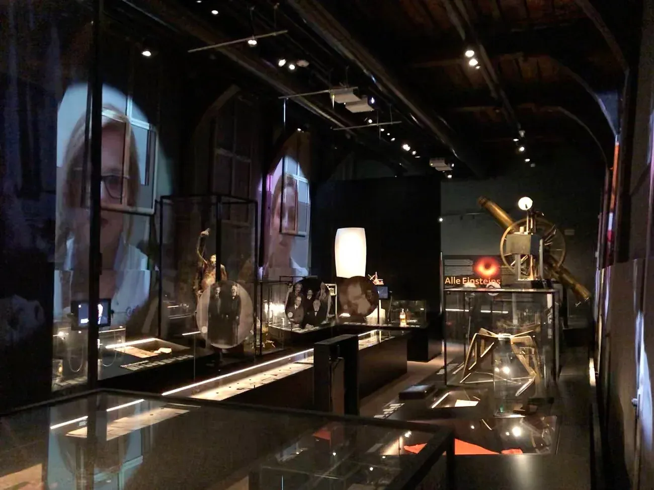 Display cases of historical scientific instruments in a gallery of Rijksmuseum Boerhaave in Leiden