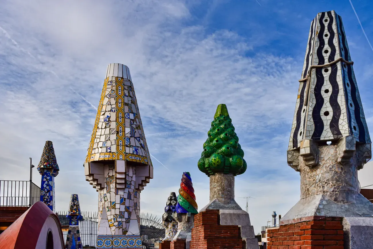 The mosaic-covered rooftop chimneys of Palau Guell in Barcelona