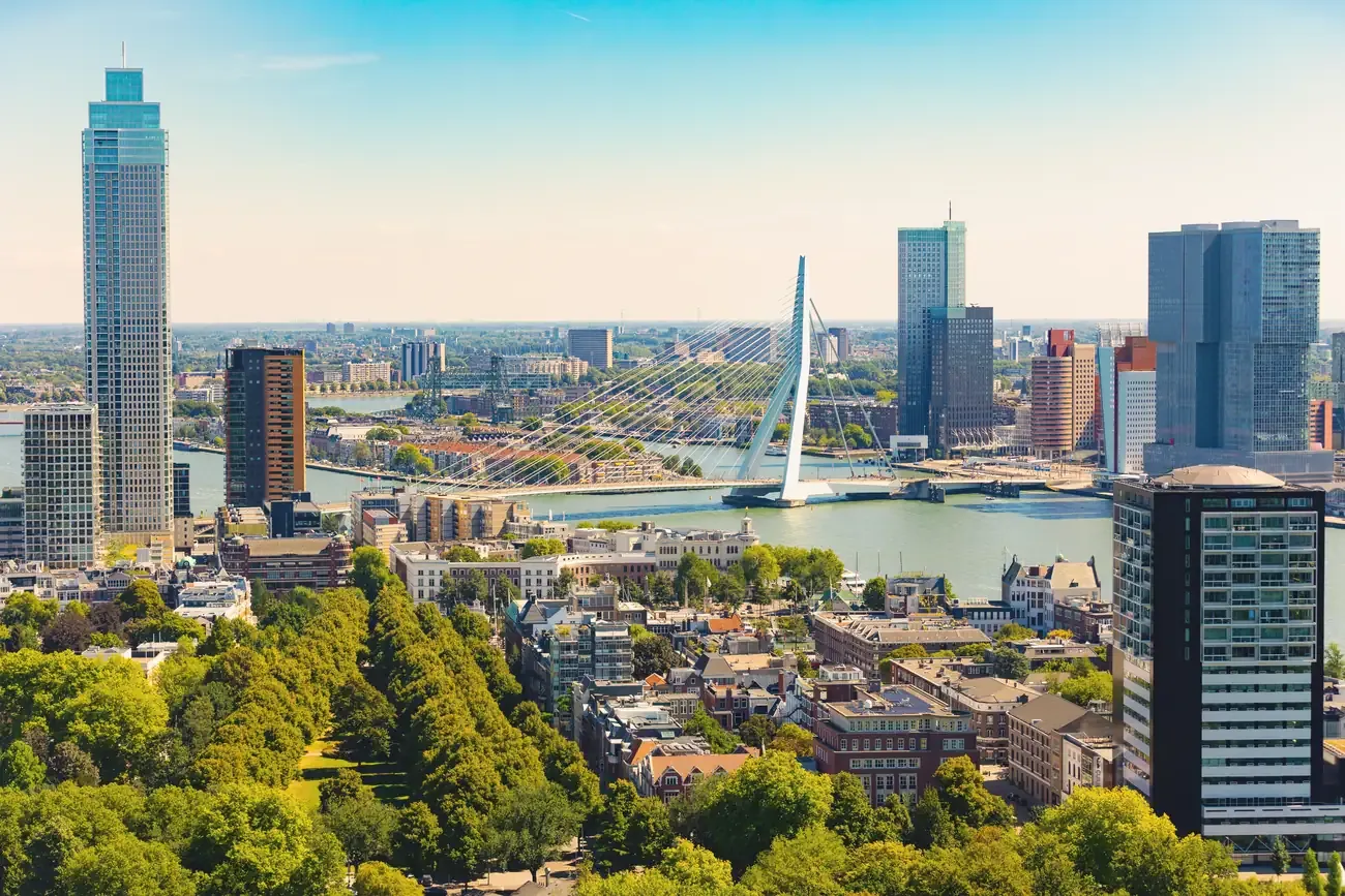 Rotterdam's skyline and the Erasmus Bridge over the river on a sunny day