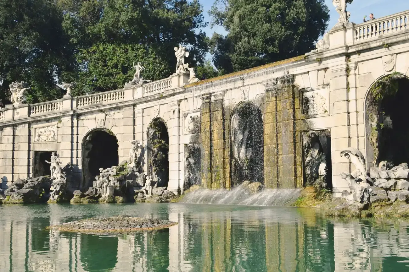 Baroque grotto fountain with mythological sculptures in the gardens of the Royal Palace of Caserta