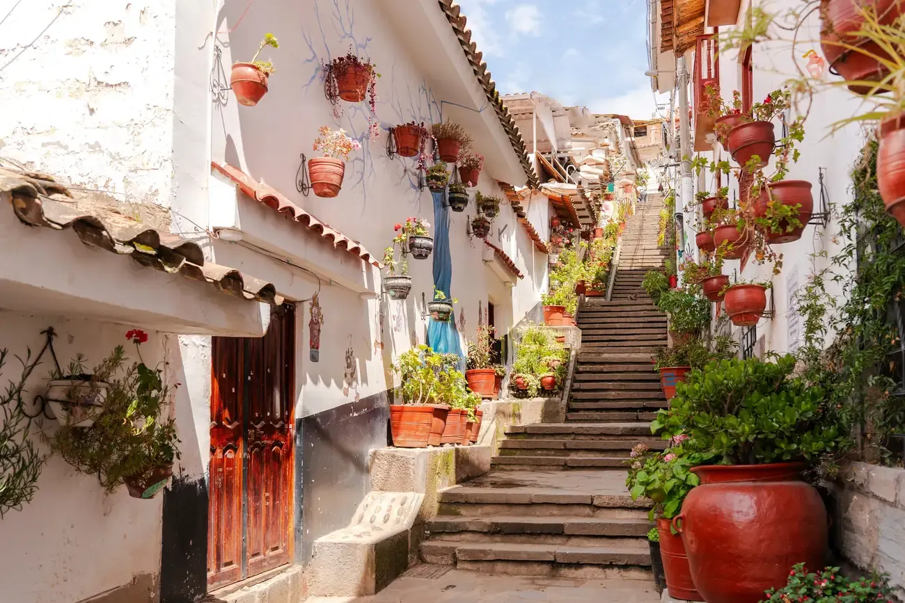A narrow flower-lined street in the San Blas neighbourhood, Cusco