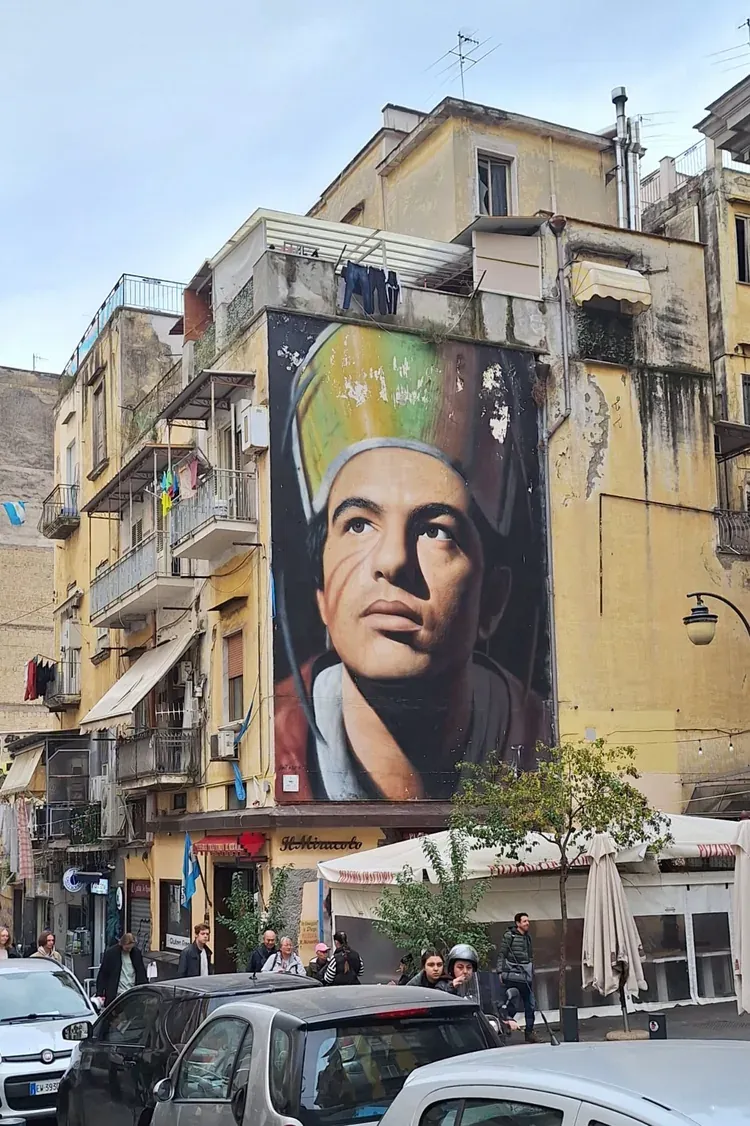 Giant mural portrait of Saint Januarius (San Gennaro) in a mitre on the side of a building in Naples