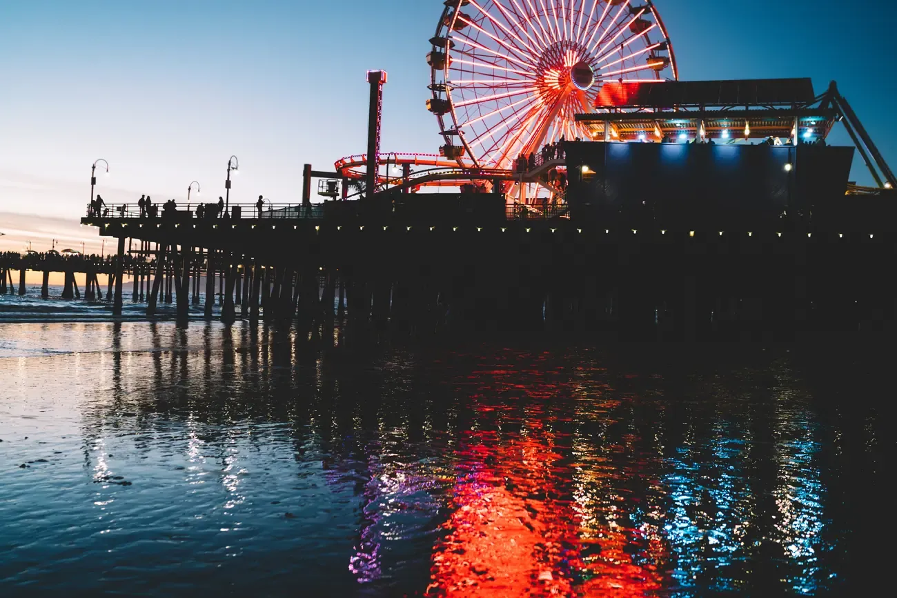 The illuminated Ferris wheel on Santa Monica Pier, Los Angeles, at night