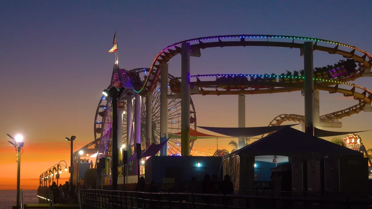 The Pacific Park roller coaster on the Santa Monica Pier at dusk near Los Angeles