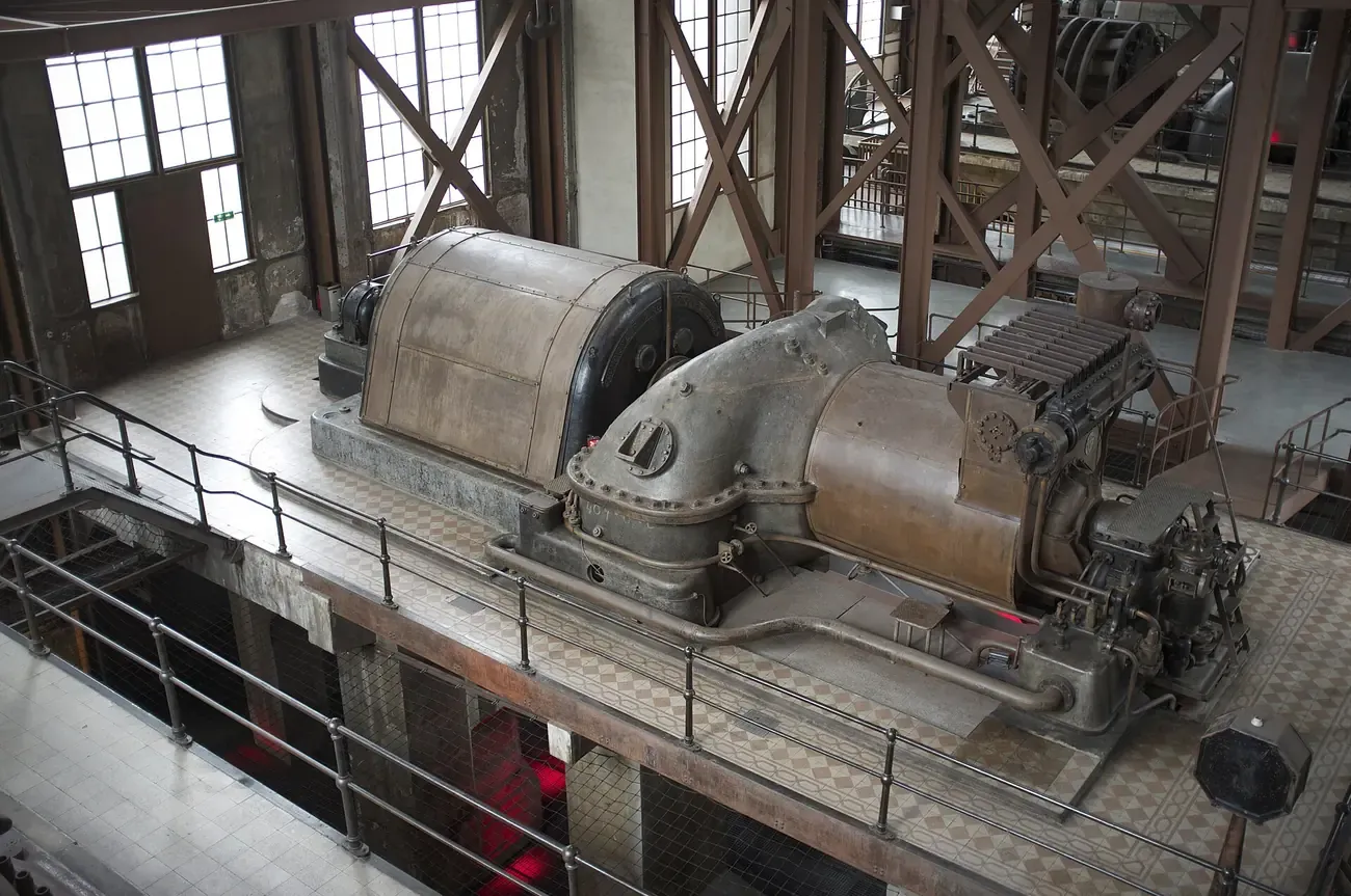 Historic steam turbine and generator in the engine room of the Silahtarağa power station, now the Museum of Energy at Santralistanbul