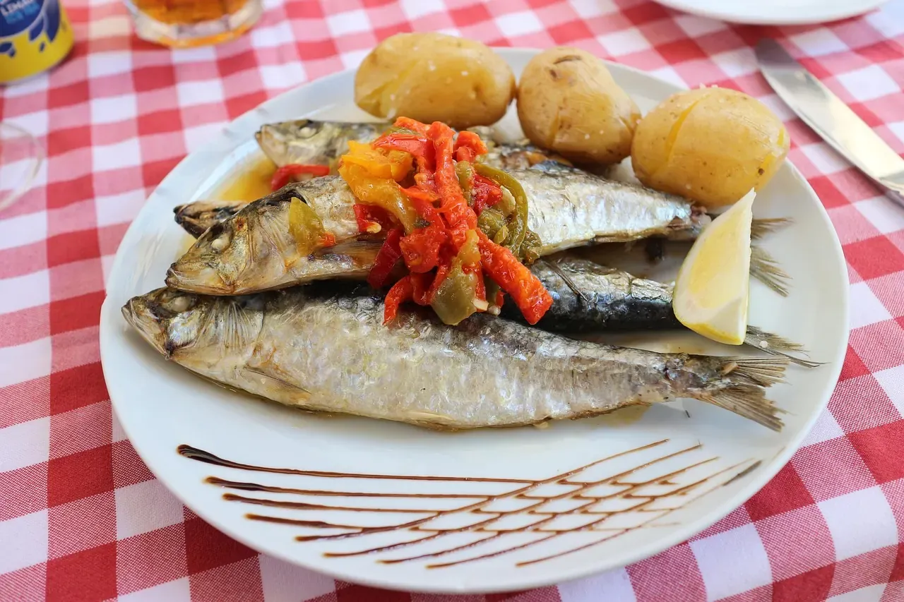 Grilled sardines served with boiled potatoes in Portugal