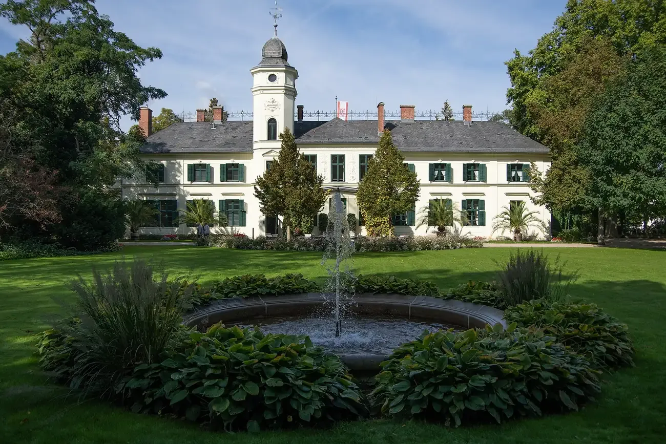 The manor house of Schloss Britz behind its garden fountain, Neukölln, Berlin