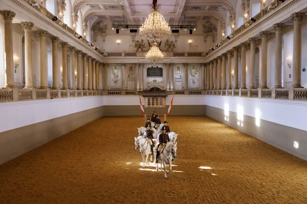 School quadrille formation with Lipizzaner stallions during a performance at the Spanish Riding School