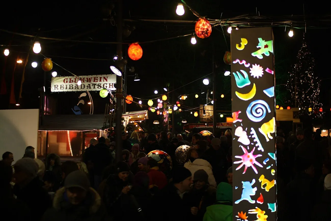 Lanterns over the Schwabing Christmas Market at Münchner Freiheit in the evening, Munich