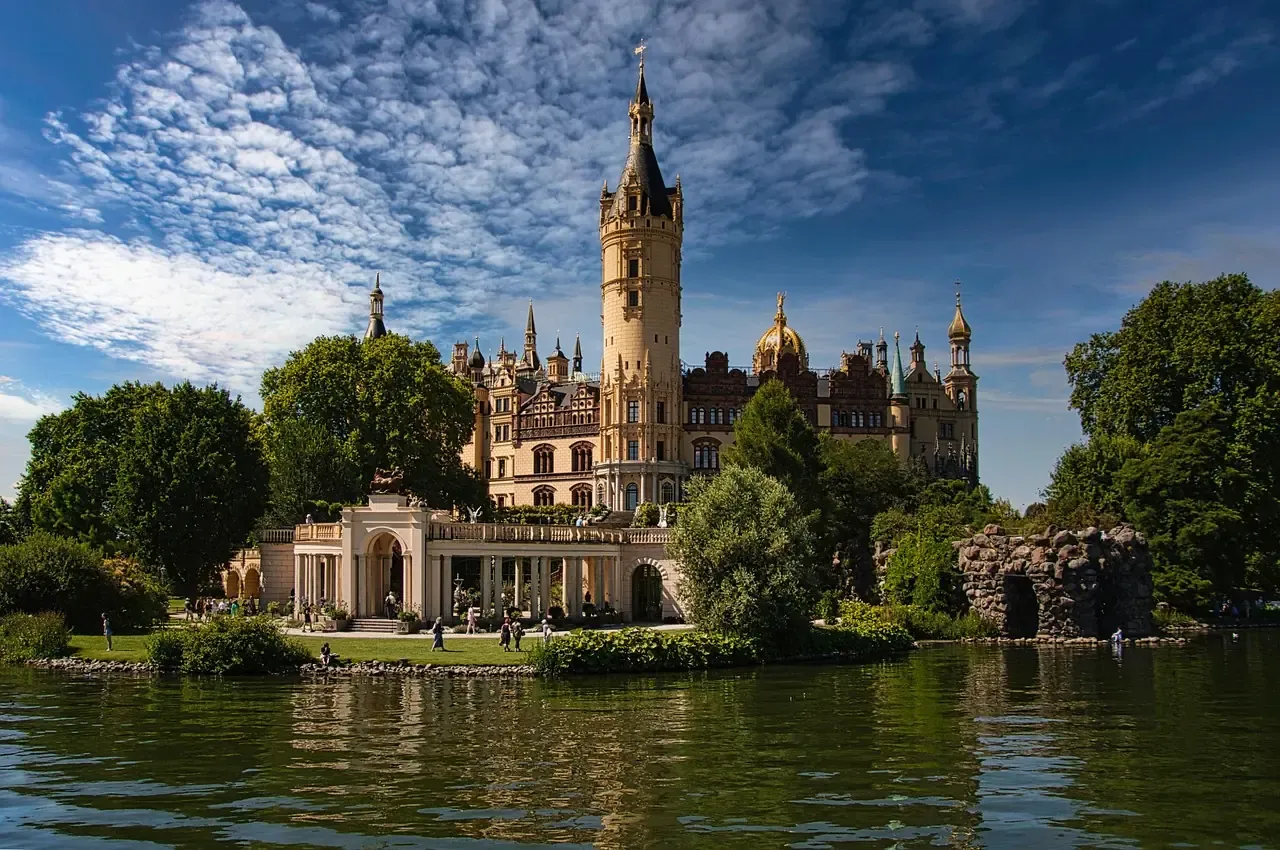 Schwerin Palace and its towers seen across the lake