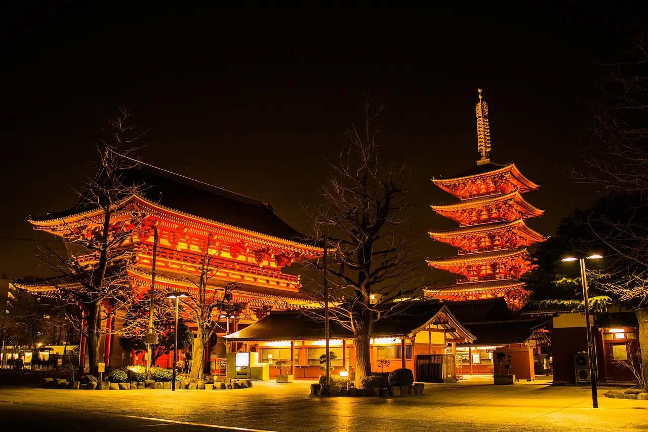 The main hall and five-storey pagoda of Senso-ji lit at night in Tokyo