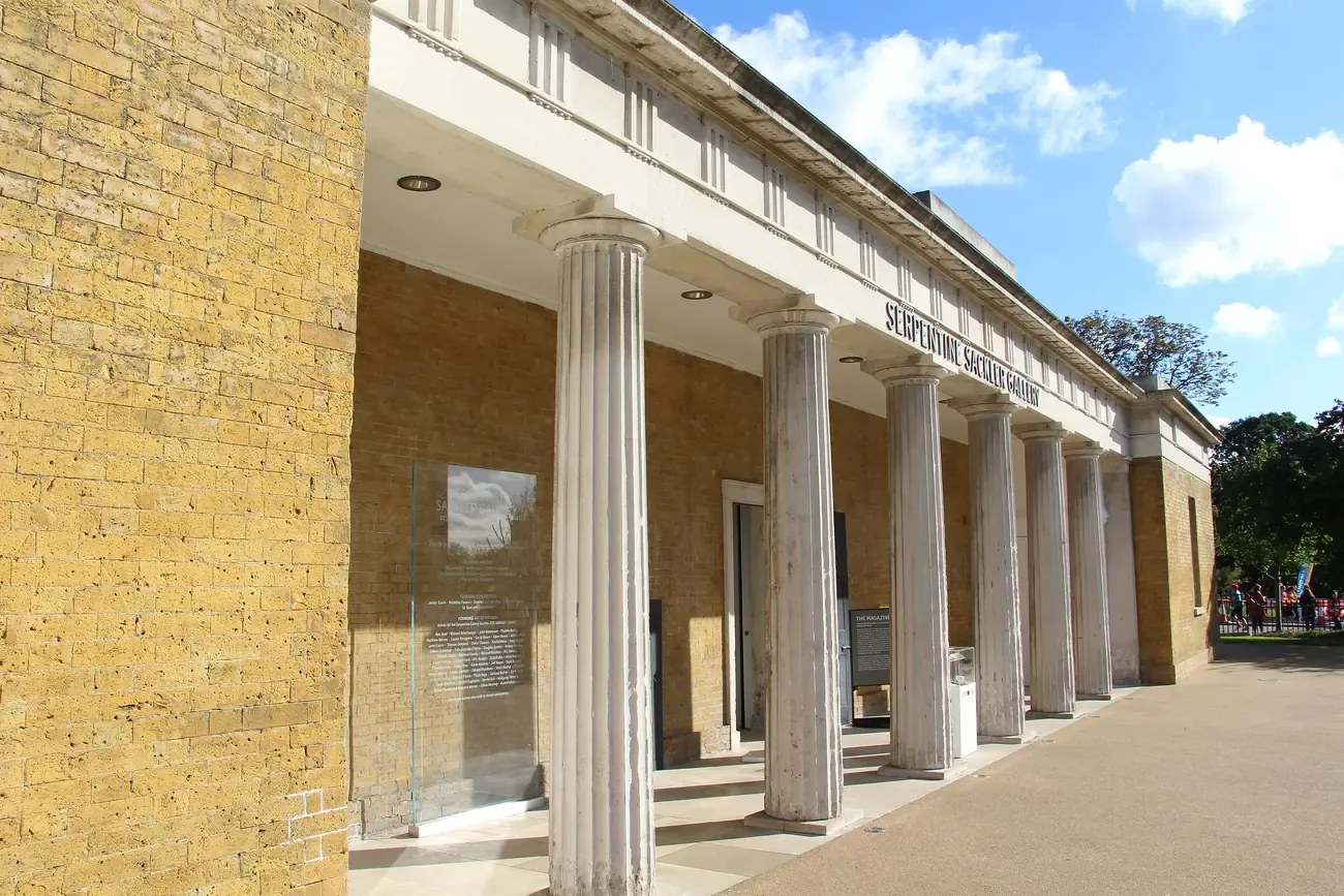 The colonnaded brick front of Serpentine North gallery in Kensington Gardens, London