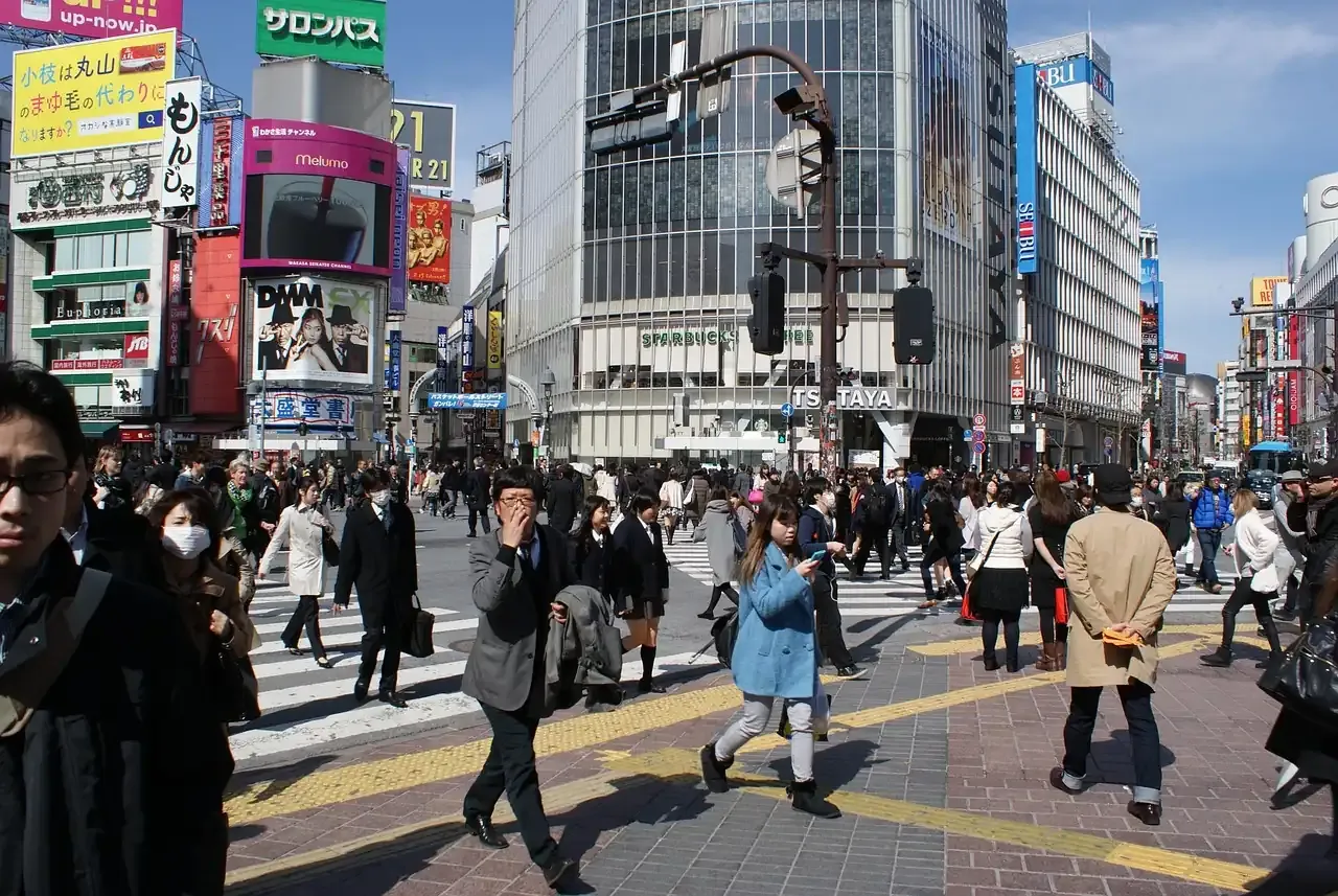 The Shibuya crossing and its surrounding shopfronts in Tokyo