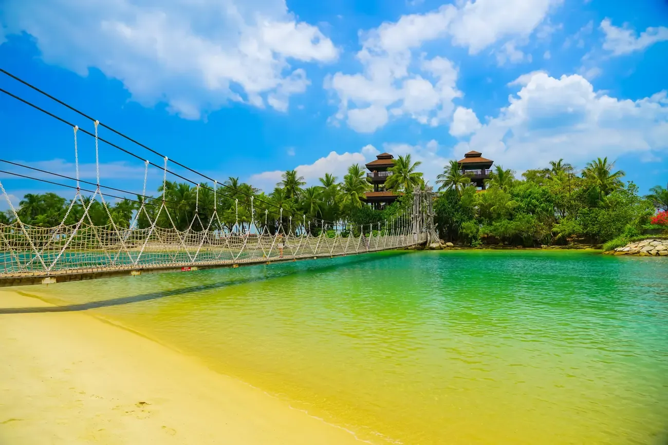The lagoon and suspension bridge at Palawan Beach on Sentosa Island, Singapore
