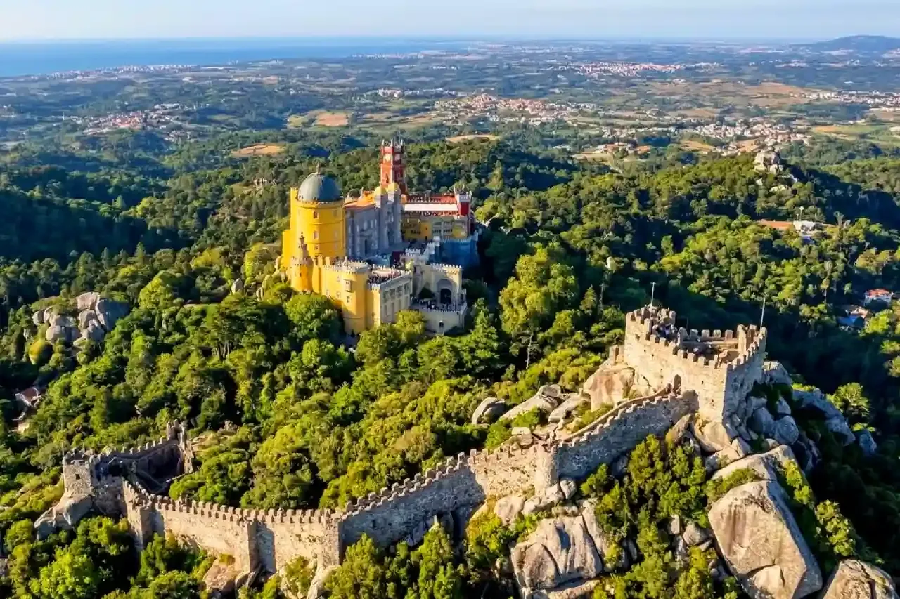Aerial view of Pena Palace and the Moorish Castle above the Sintra hills.