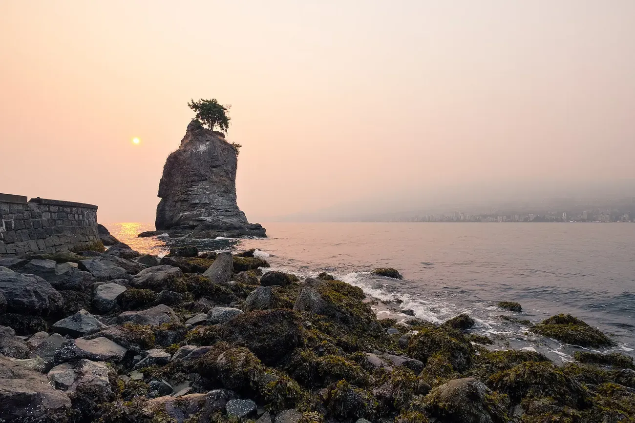 The sea stack of Siwash Rock off the Stanley Park shore in Vancouver