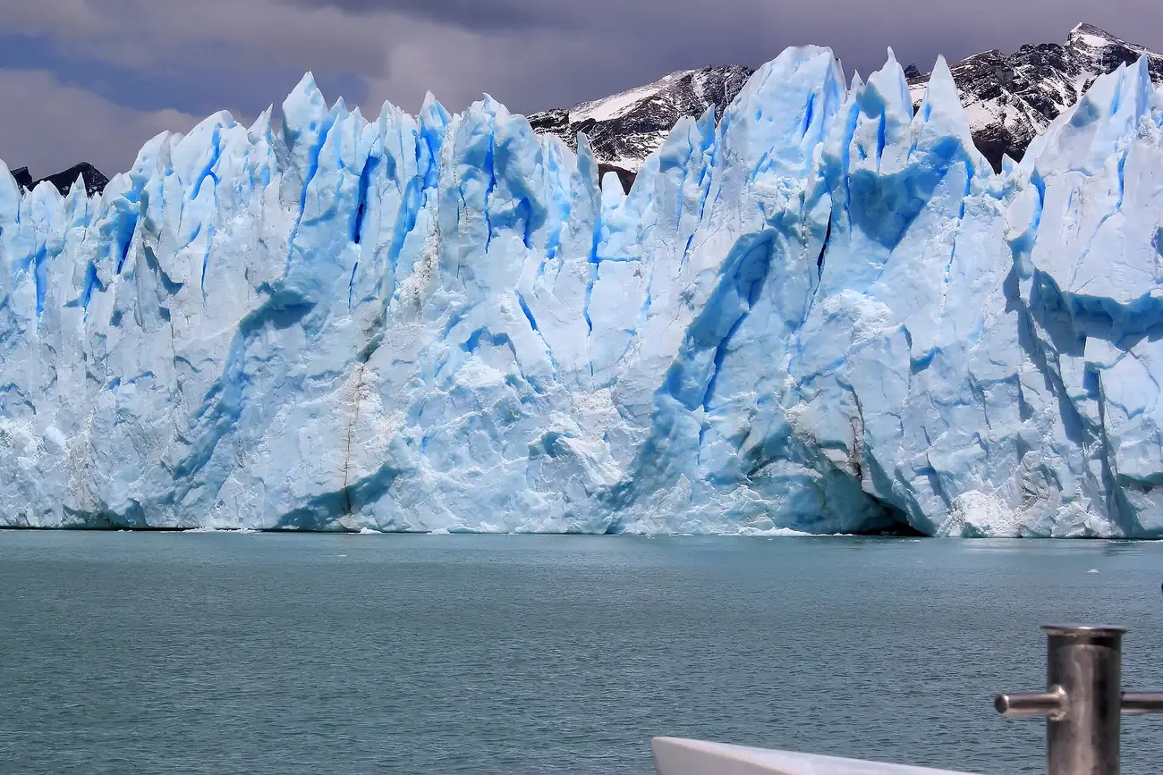 The towering blue ice wall of the Spegazzini Glacier seen from a Lago Argentino boat near El Calafate