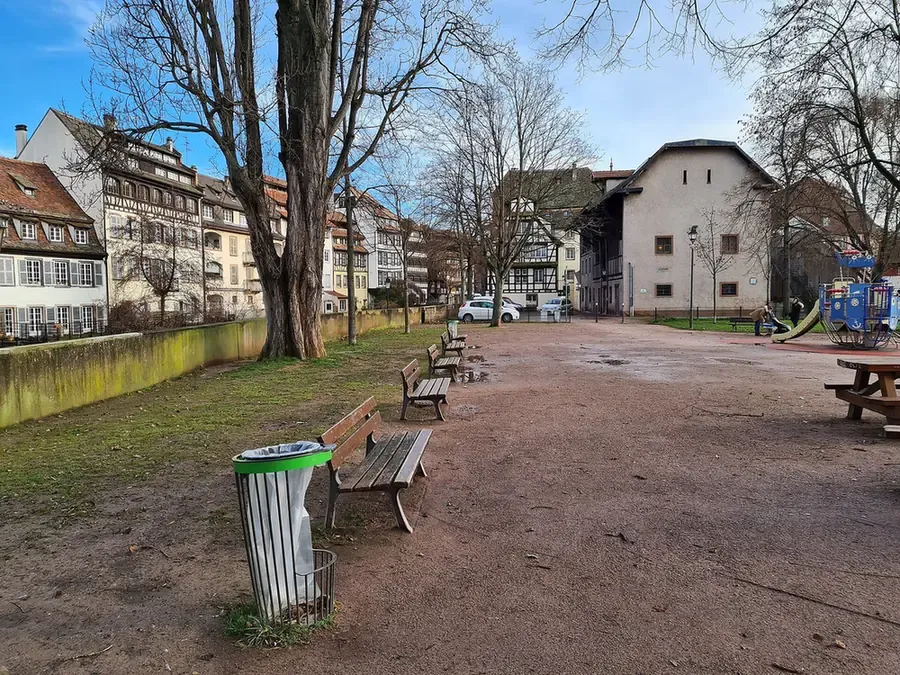 Square Louise-Weiss in the Petite France quarter of Strasbourg, with benches and plane trees