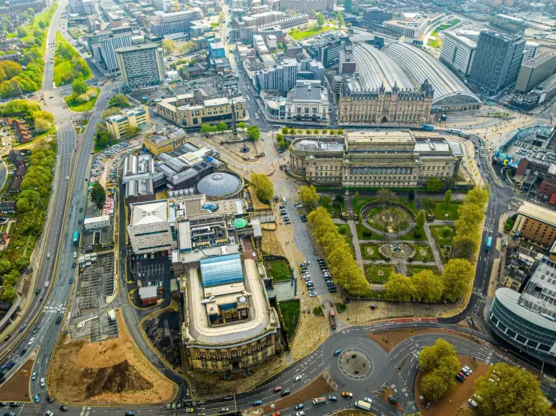 Aerial view of St George's Hall and St John's Gardens with the train sheds of Lime Street station behind them in Liverpool