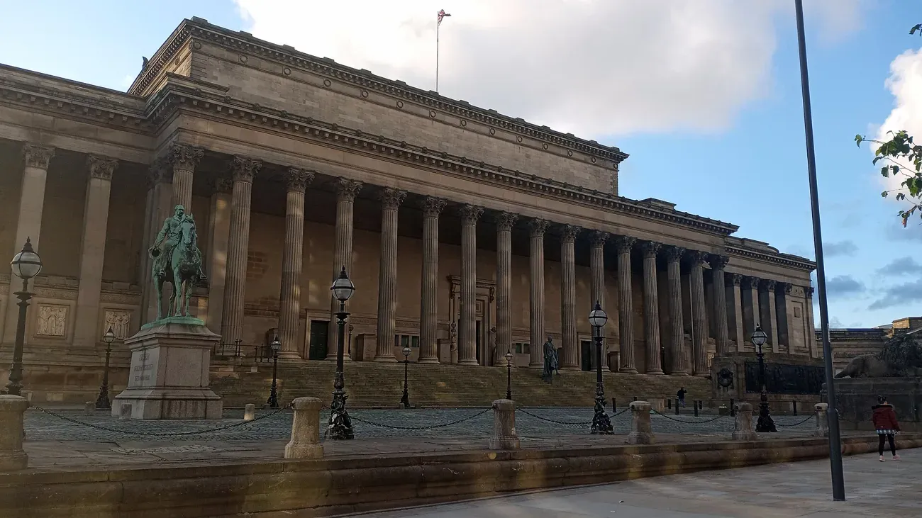 The Corinthian colonnade of St George's Hall with an equestrian statue in front, Liverpool