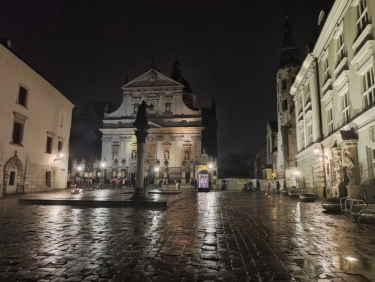 St Mary Magdalene Square in Krakow at night, with the Church of Saints Peter and Paul and its lit facade