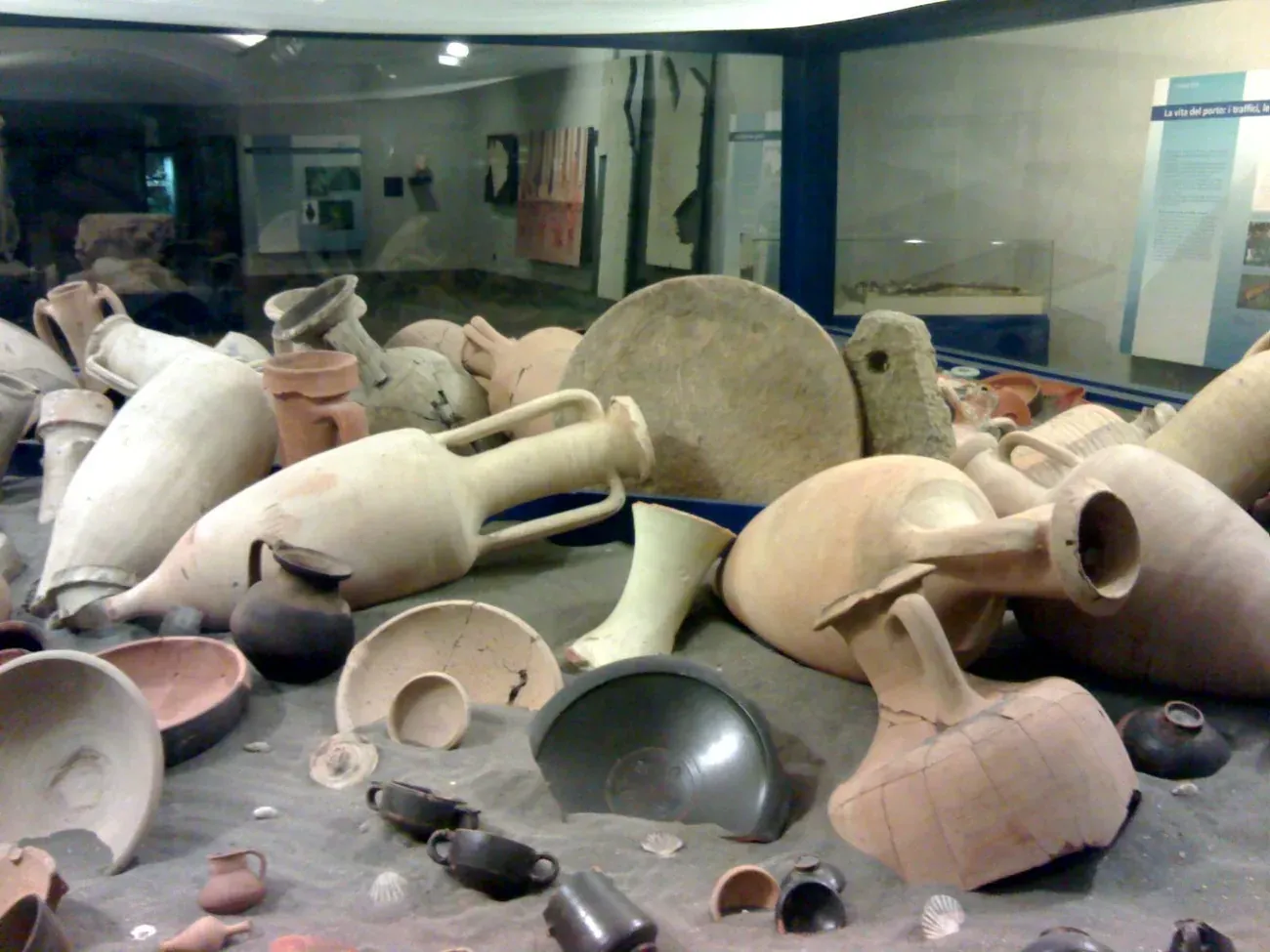 Roman amphorae and pottery in the archaeological display at the Museo Neapolis metro station in Naples