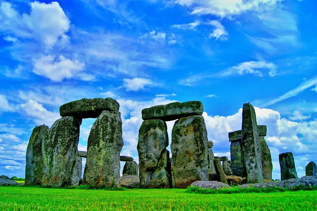 Trilithons of Stonehenge under a bright blue sky in Wiltshire