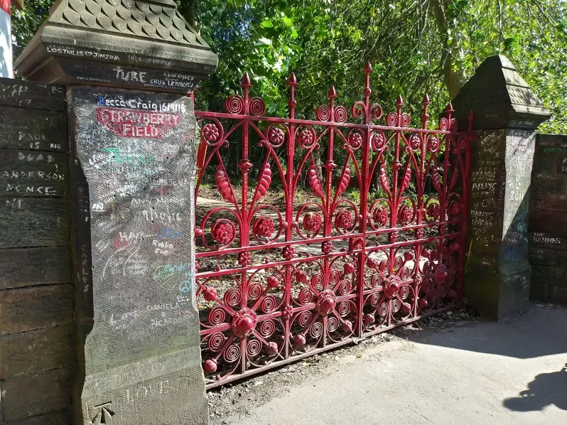The red replica gates at the entrance to Strawberry Field in Woolton, Liverpool