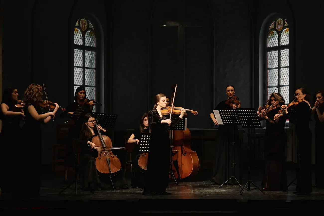String orchestra performing in a church