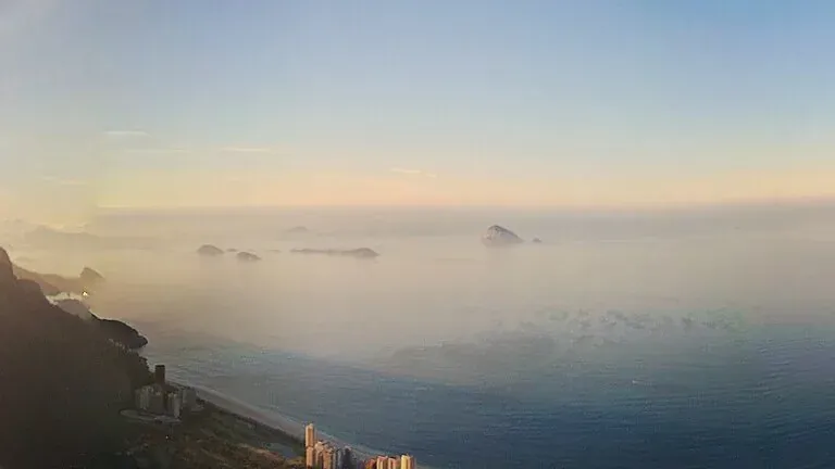 Sunrise over the sea from a rock in Tijuca National Park above Rio de Janeiro
