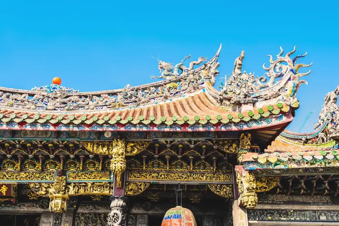 The ornate decorated roof of Longshan Temple in Taipei