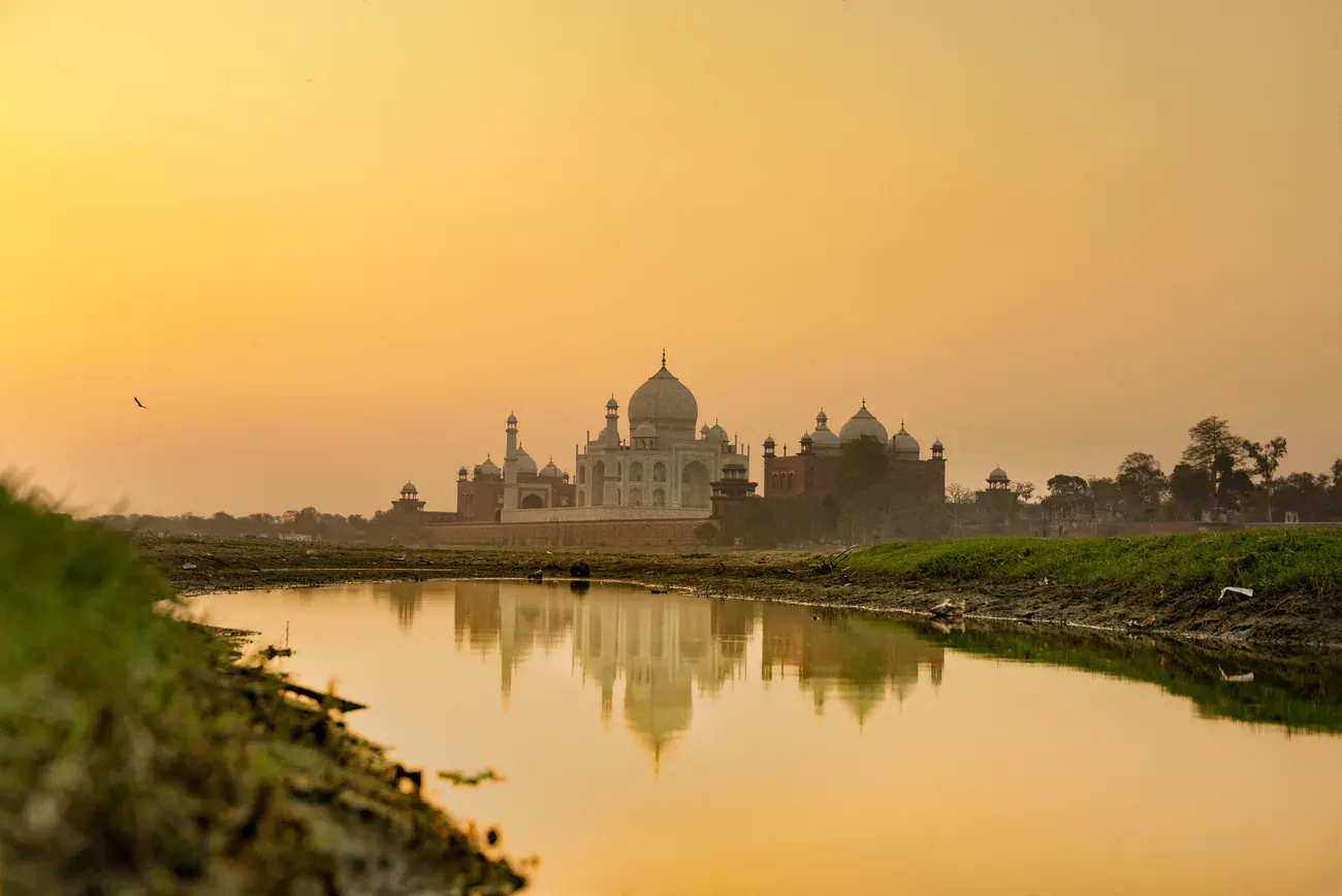 The Taj Mahal reflected in the water at sunset, Agra, India