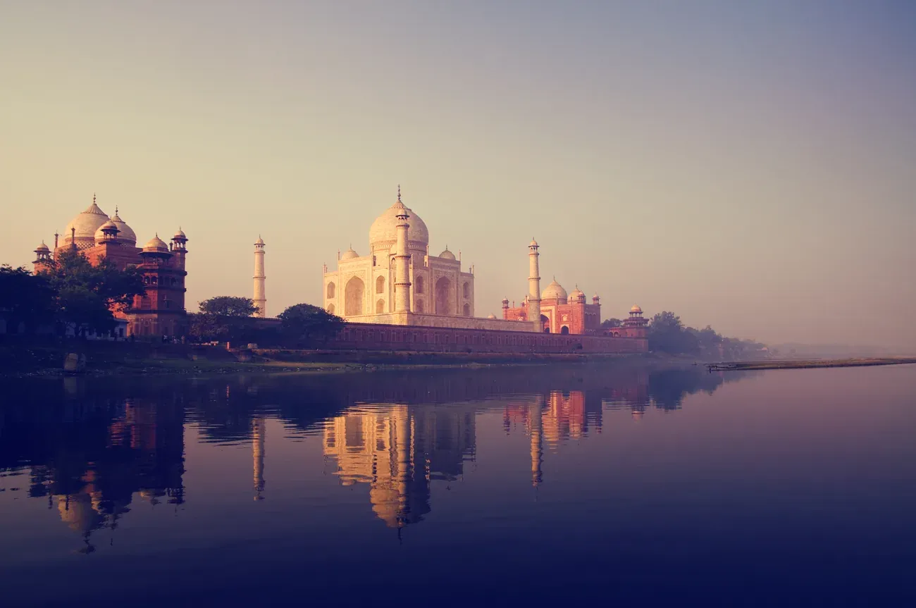 The Taj Mahal reflected in the Yamuna river, Agra, India