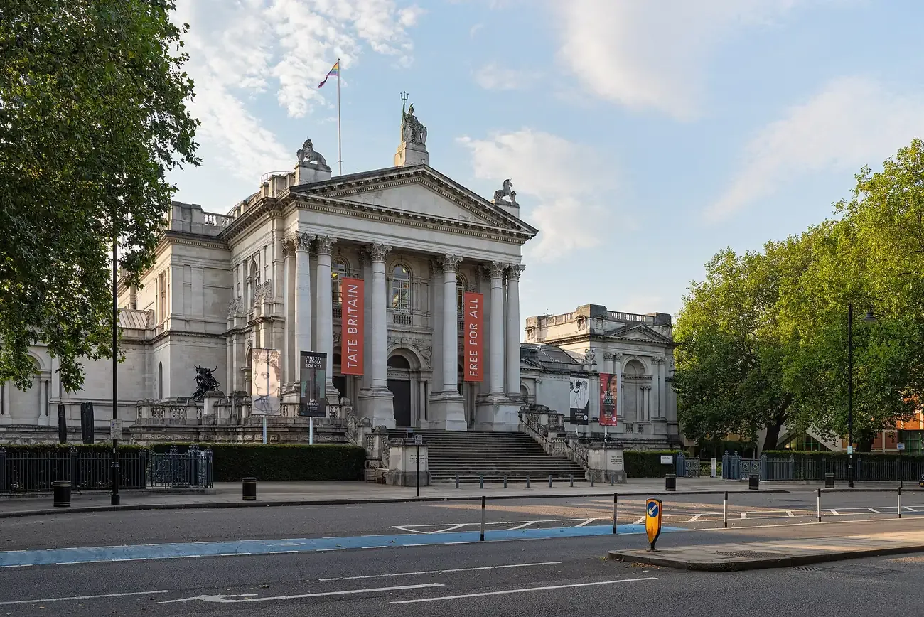 The columned front of Tate Britain on Millbank, London, in evening light