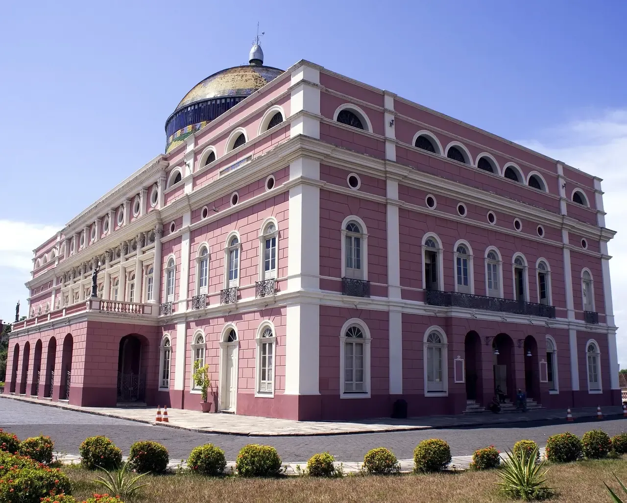 The pink facade and tiled dome of the Teatro Amazonas in Manaus