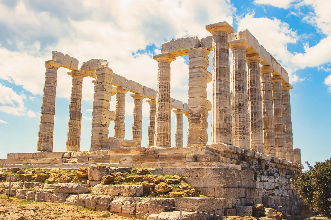 The Temple of Poseidon at Cape Sounion under a blue sky