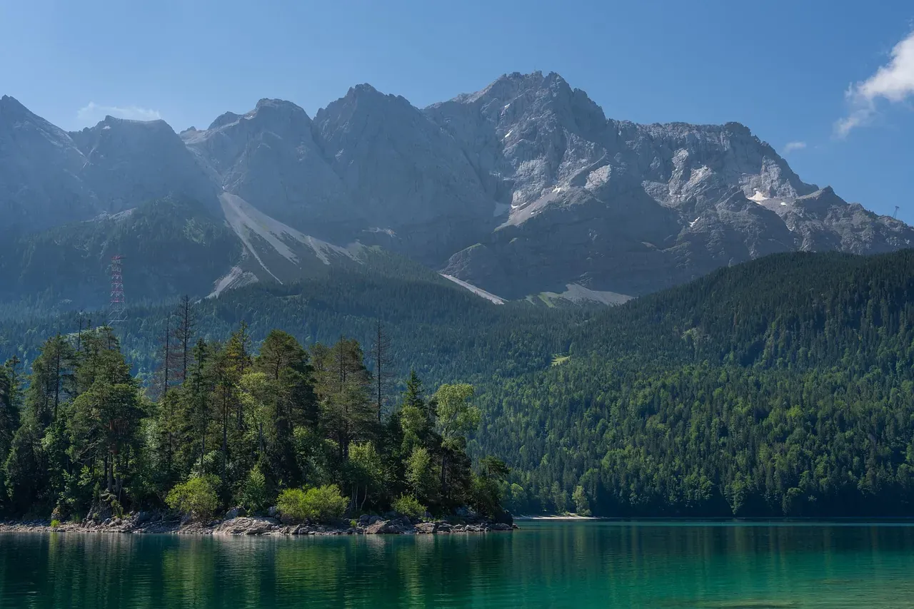 The Eibsee and its wooded islands below the Zugspitze massif in Bavaria