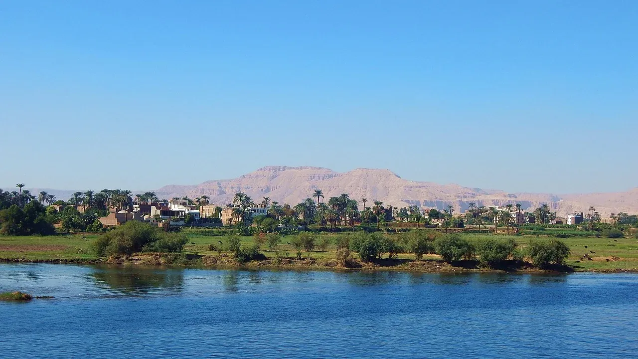 The Nile at Luxor with the Theban hills on the west bank