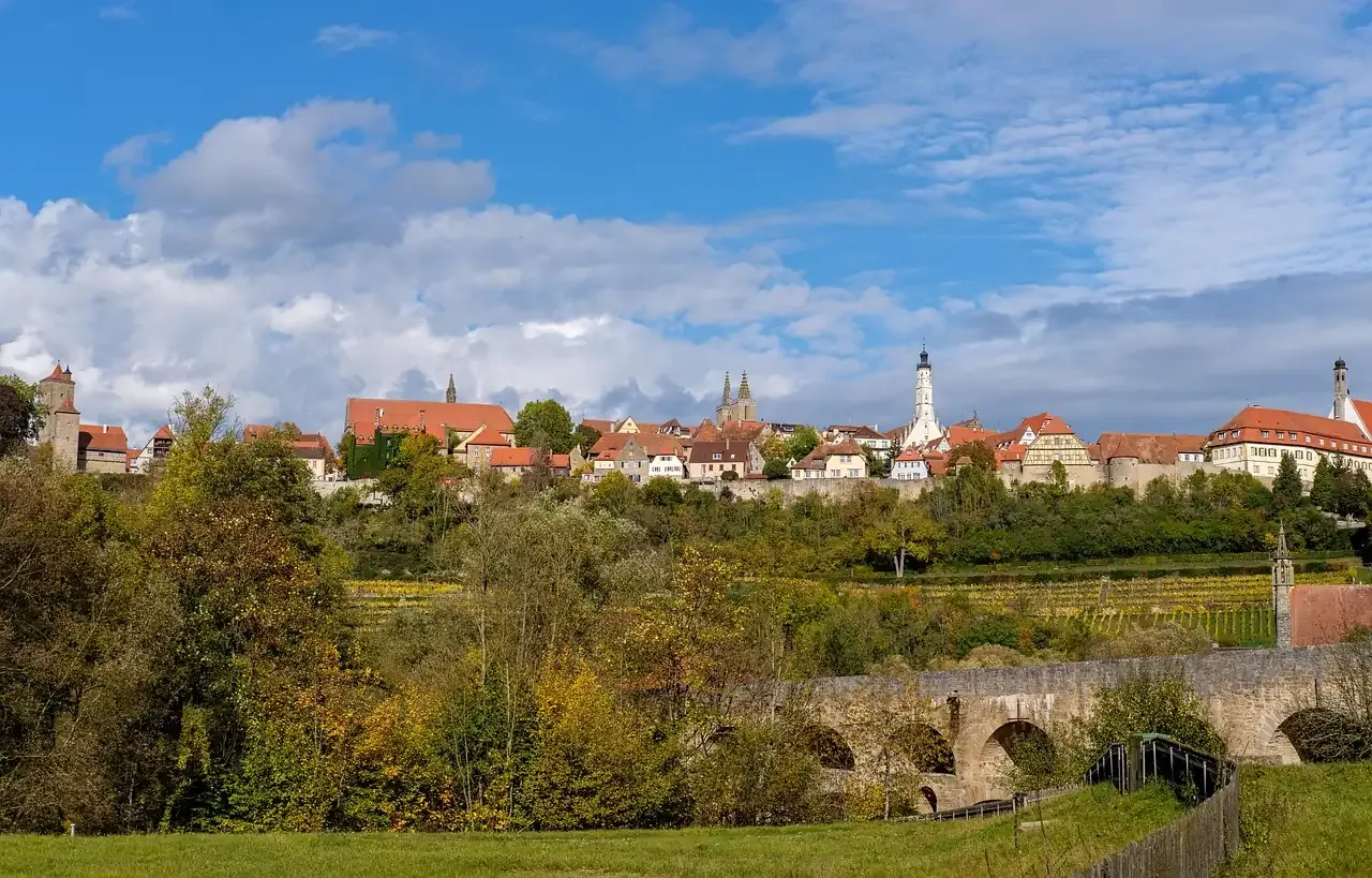 Rothenburg ob der Tauber above the Tauber valley with its double bridge in autumn