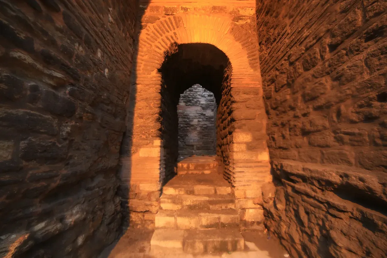 Stone steps rising through a narrow arched passage in the Theodosian land walls near the Palace of the Porphyrogenitus in Istanbul