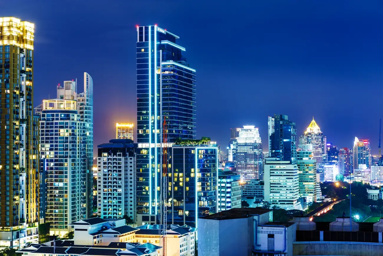 Bangkok's skyline lit up at night.
