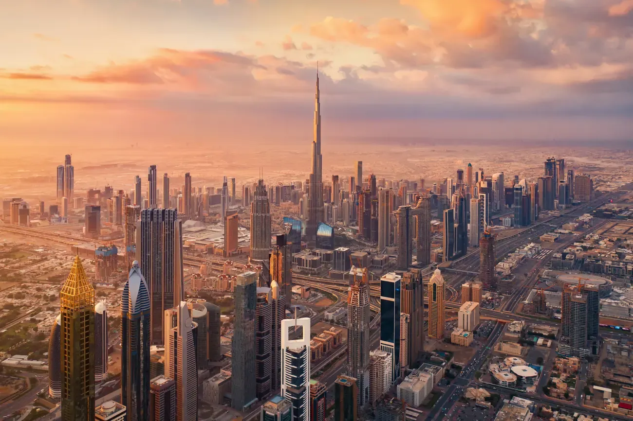 Downtown Dubai's skyline and the Burj Khalifa at golden hour.