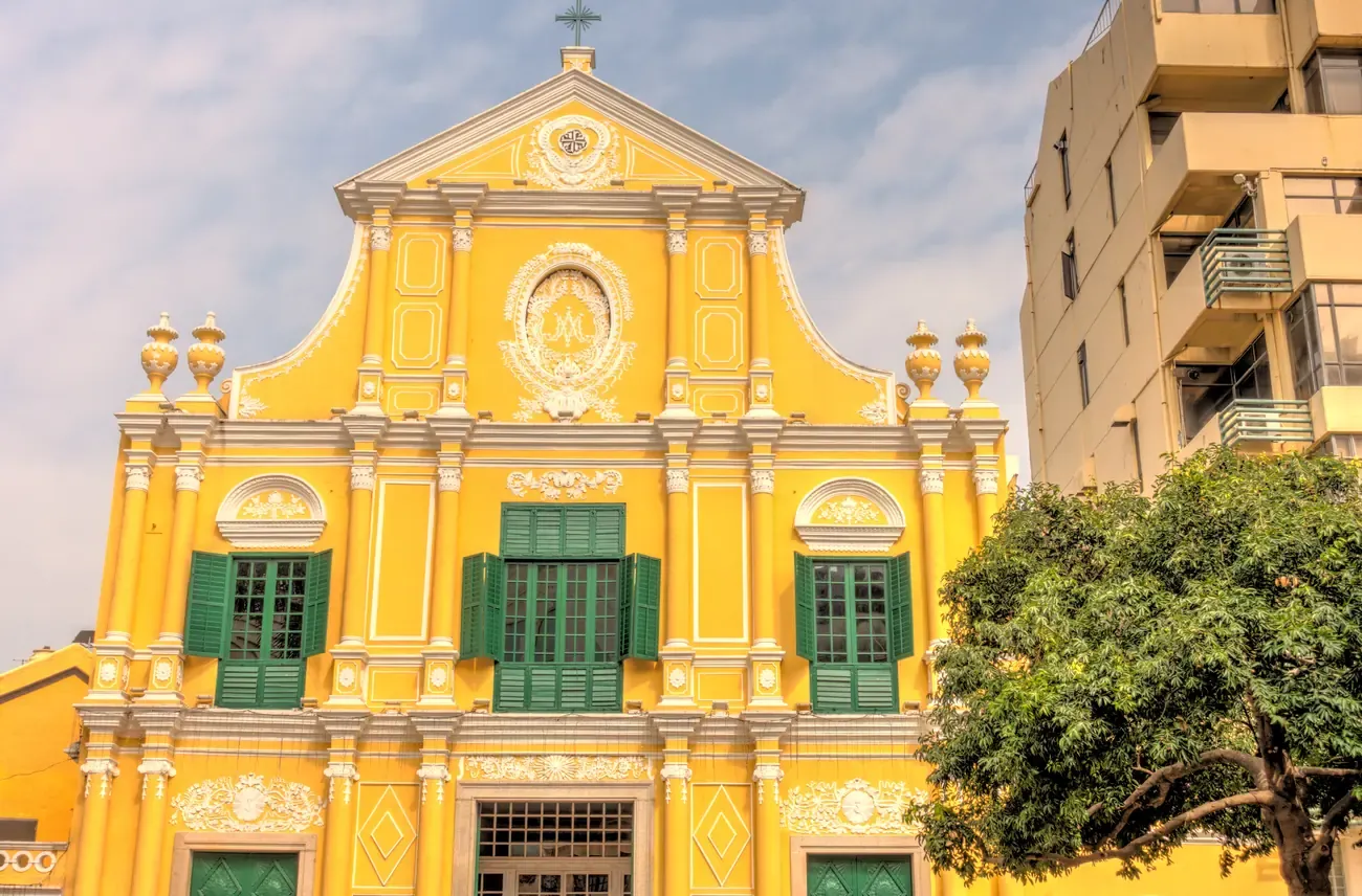 The yellow baroque facade of St Dominic's Church in Macau's historic centre.