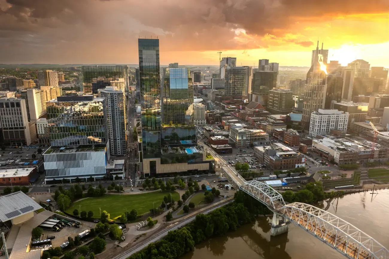 Downtown Nashville towers and the Cumberland River bridges at sunset