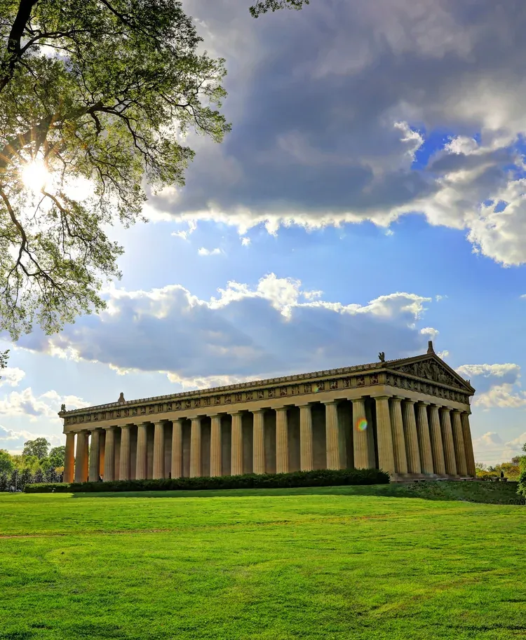 The Nashville Parthenon seen along its colonnade from the park lawn