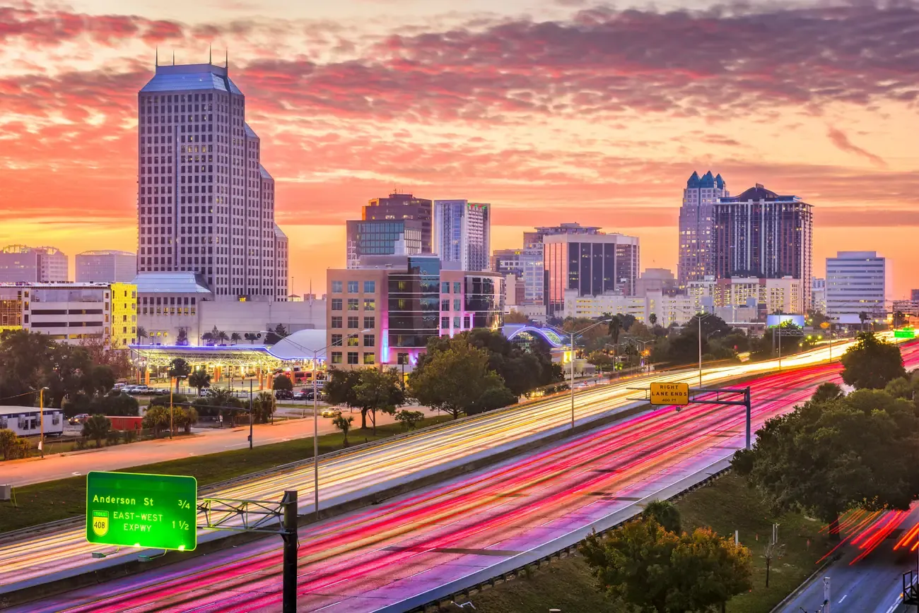 Downtown Orlando skyline above the expressway at sunset